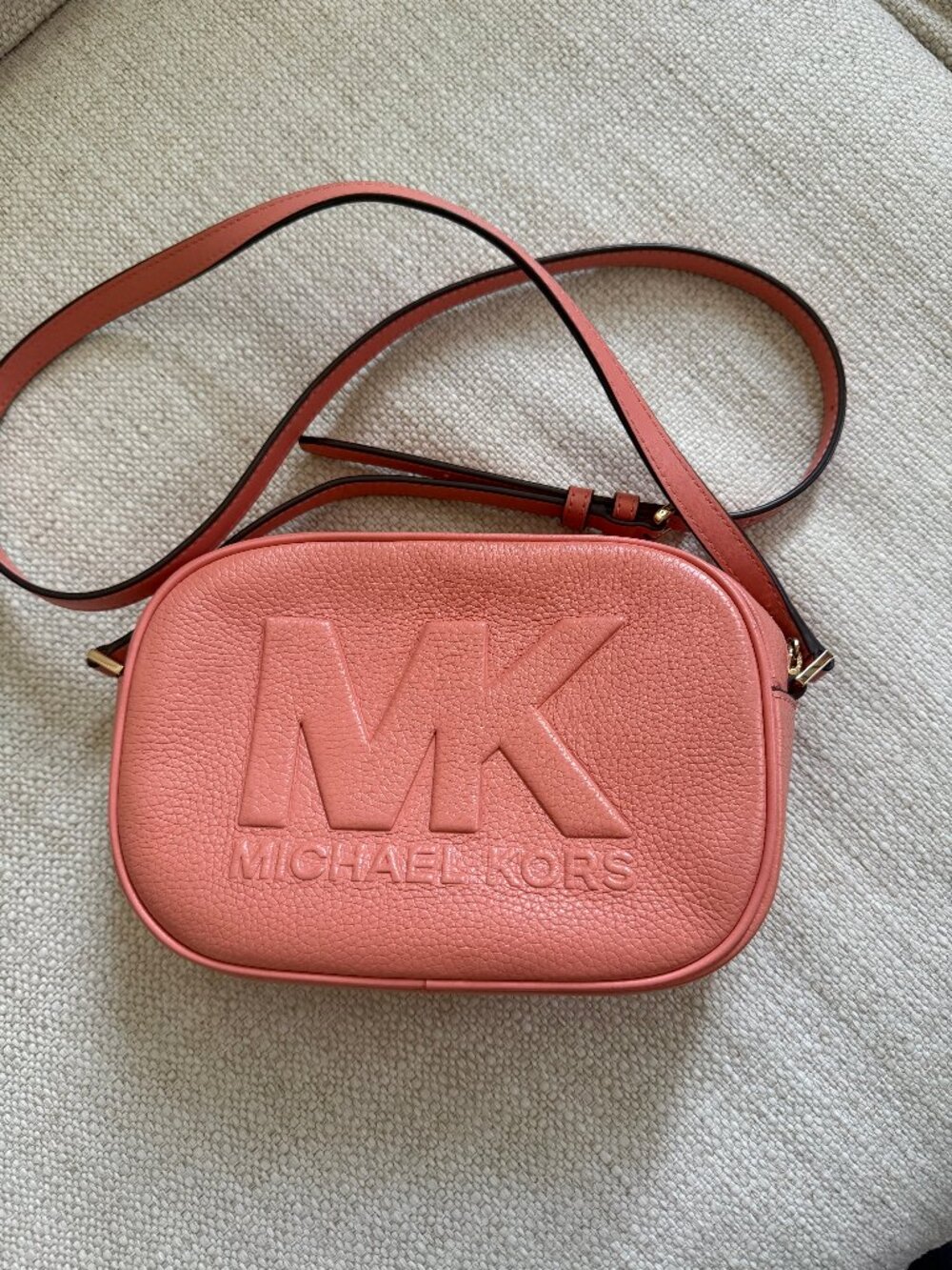 Michael Kors crossbody bag in a beautiful coral/pink shade.